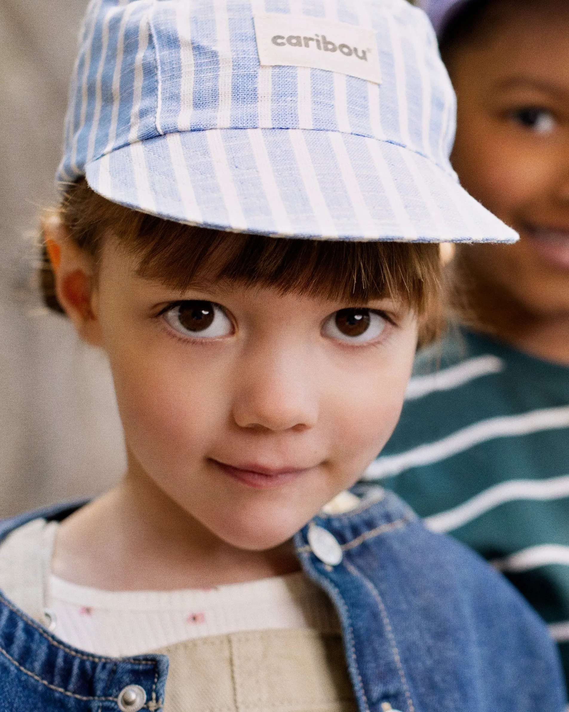 Linen cap by Caribou, blue stripes sold by atelier b