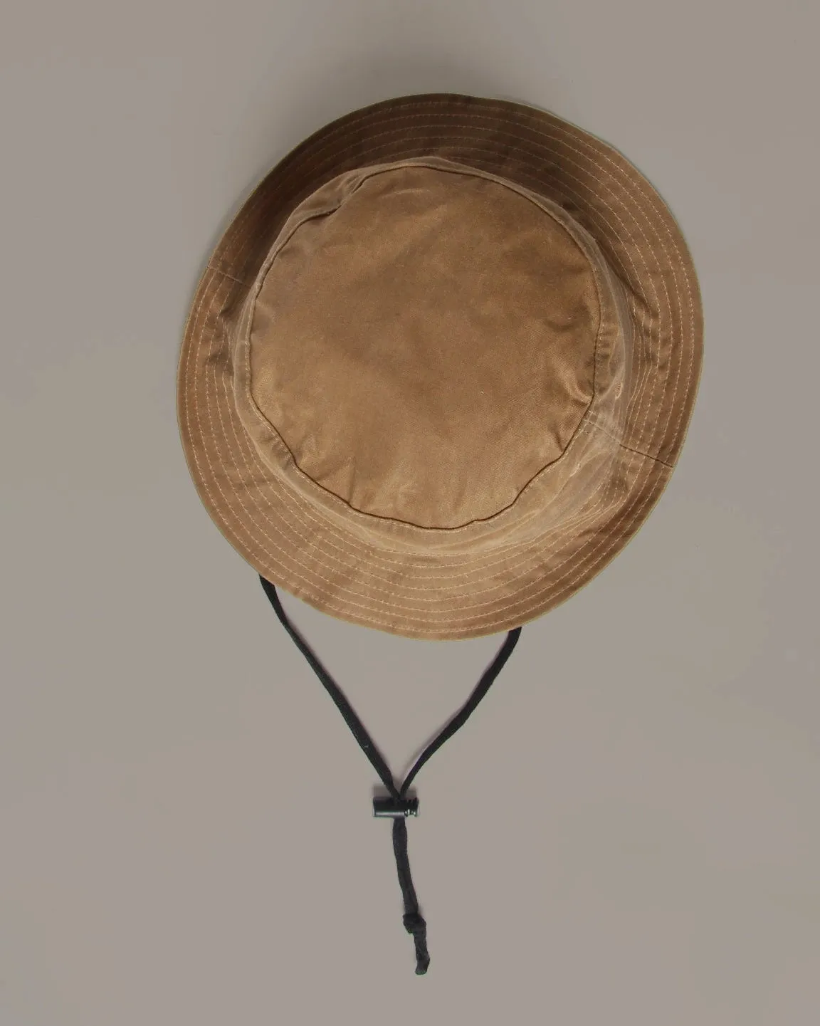 Sun hat by Mutton Head, waxed cotton sold by atelier b