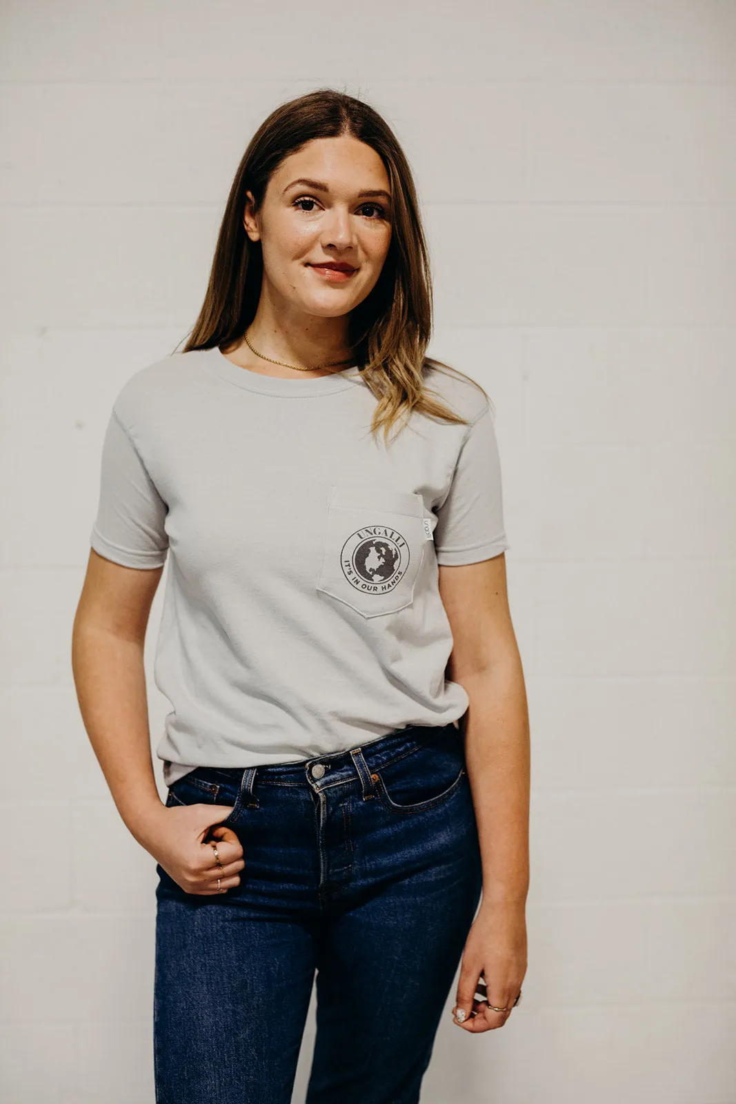 In Our Hands Pocket Tee sold by Ungalli