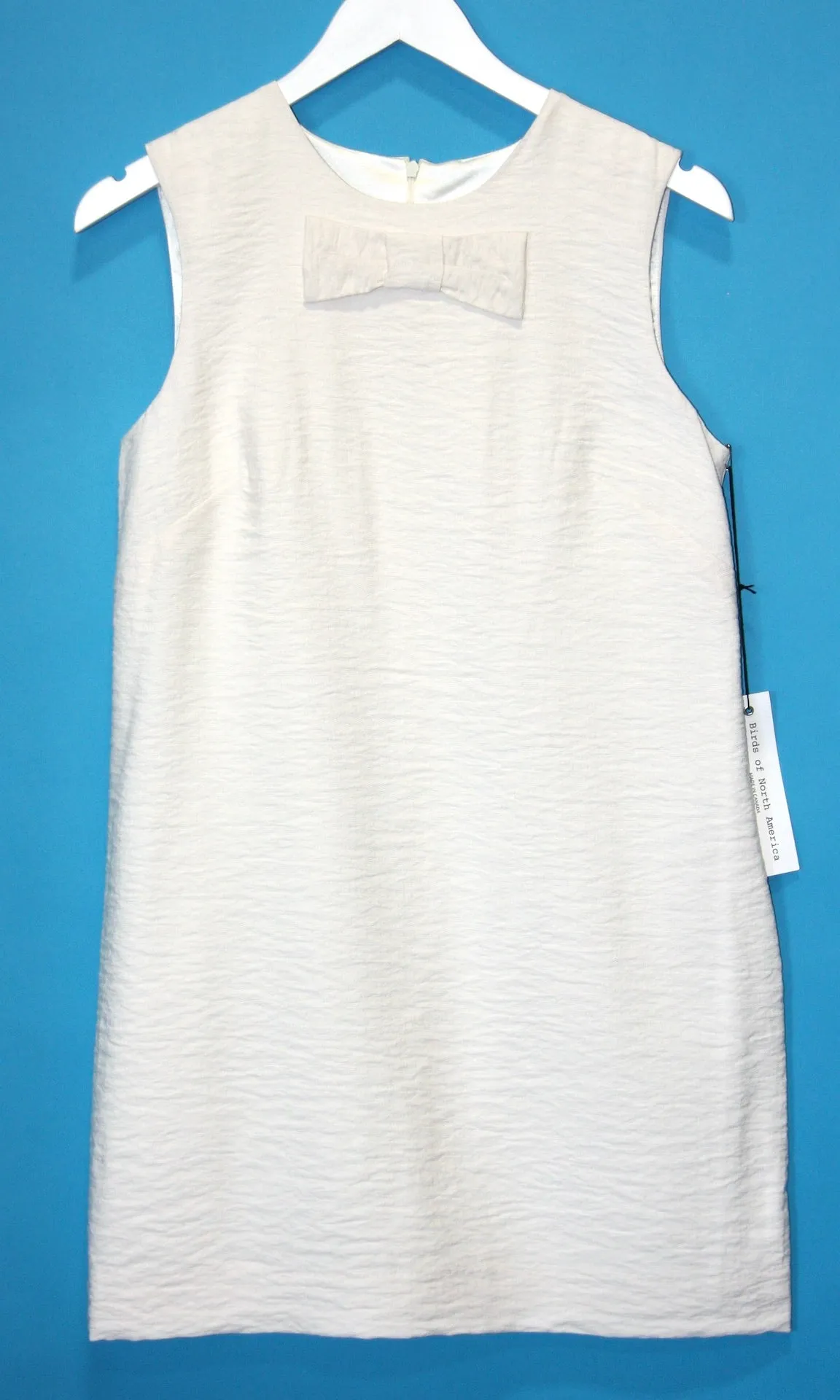 SS142 - 8 - Flutter Dress - Ivory sold by Birds of North America