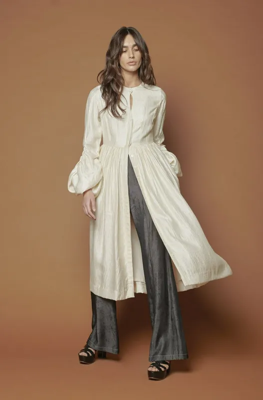 midi dress with gathered sleeves. sold by Baruni