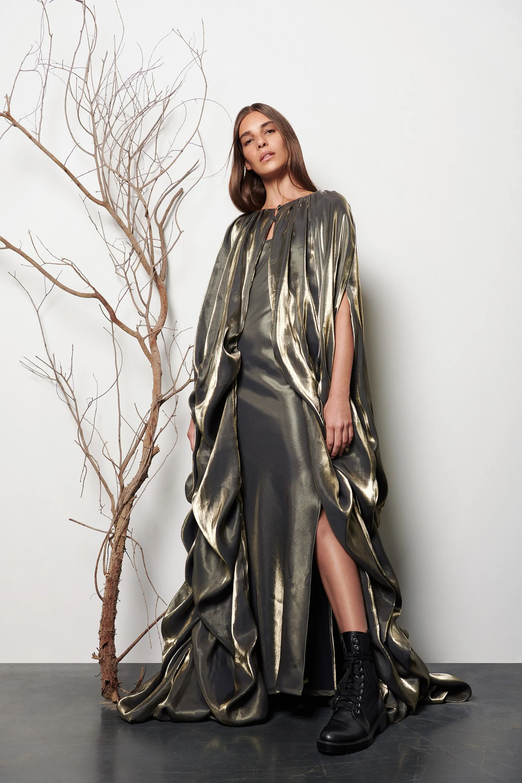 Long gathered cape sold by Baruni