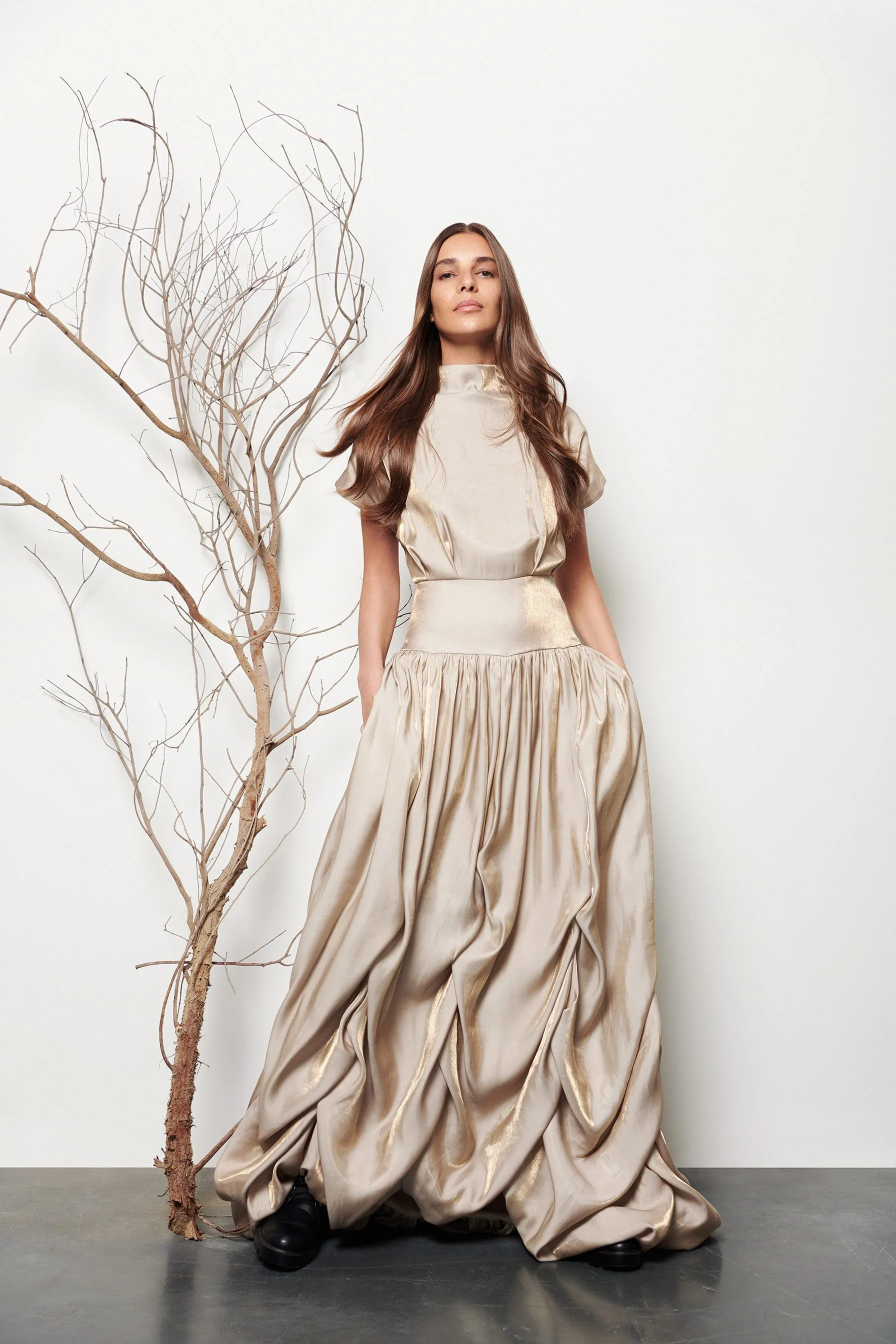 Long gathered dress sold by Baruni