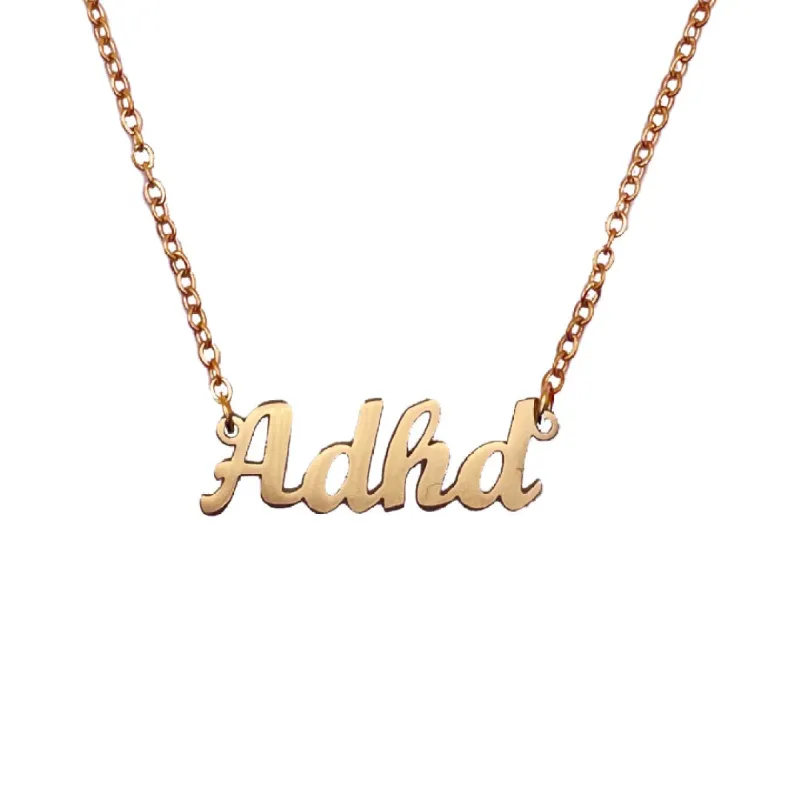 "Adhd" Script Nameplate Necklace sold by Mad Fine