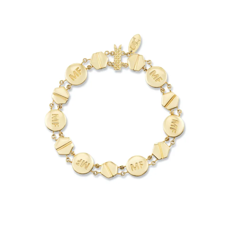 Gold abortion pill bracelet made by Mad Fine