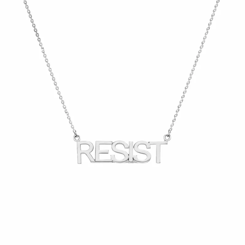 Silver 'RESIST' Nameplate sold by Mad Fine