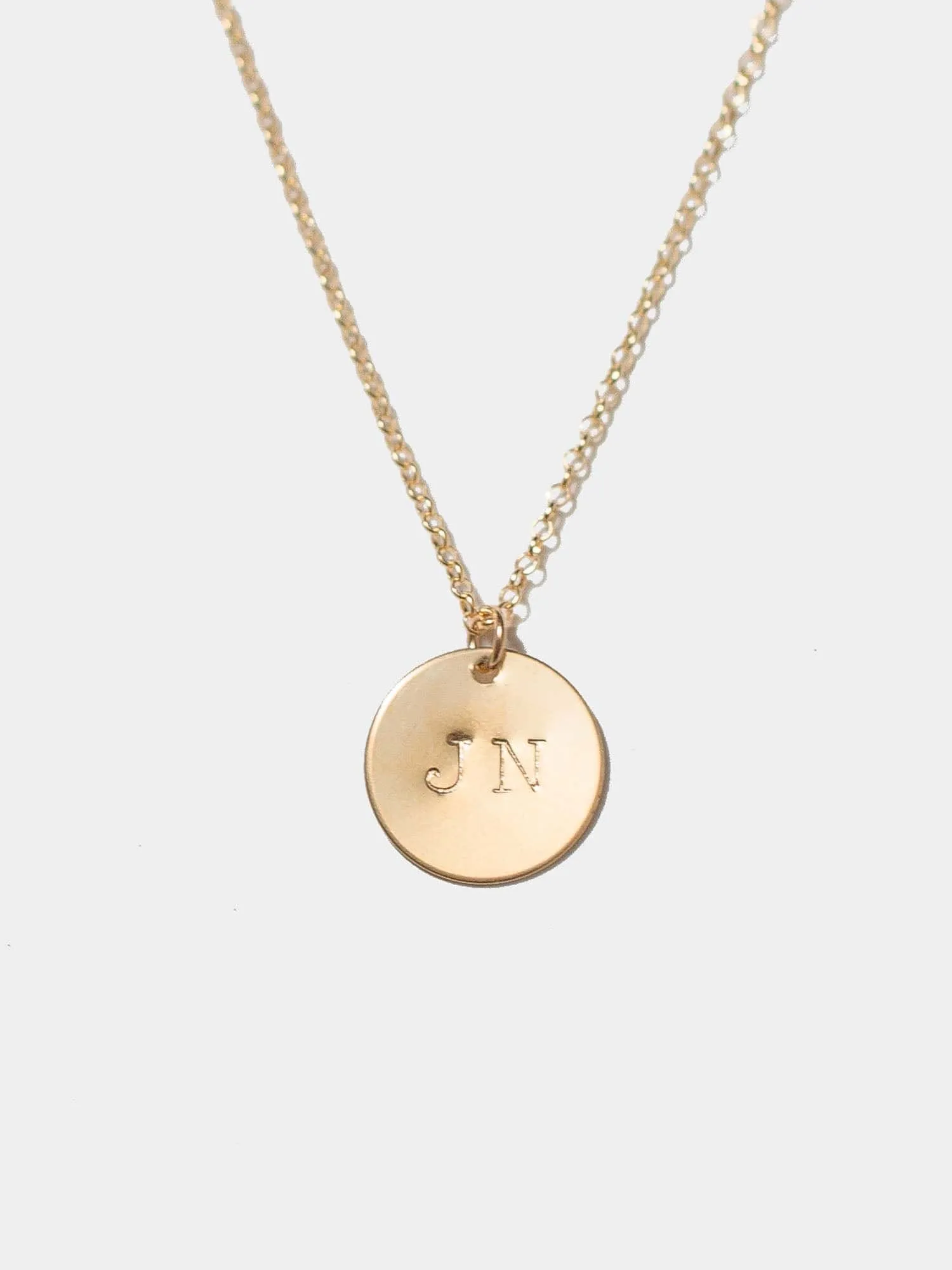 Initial Disc Necklace sold by OXB
