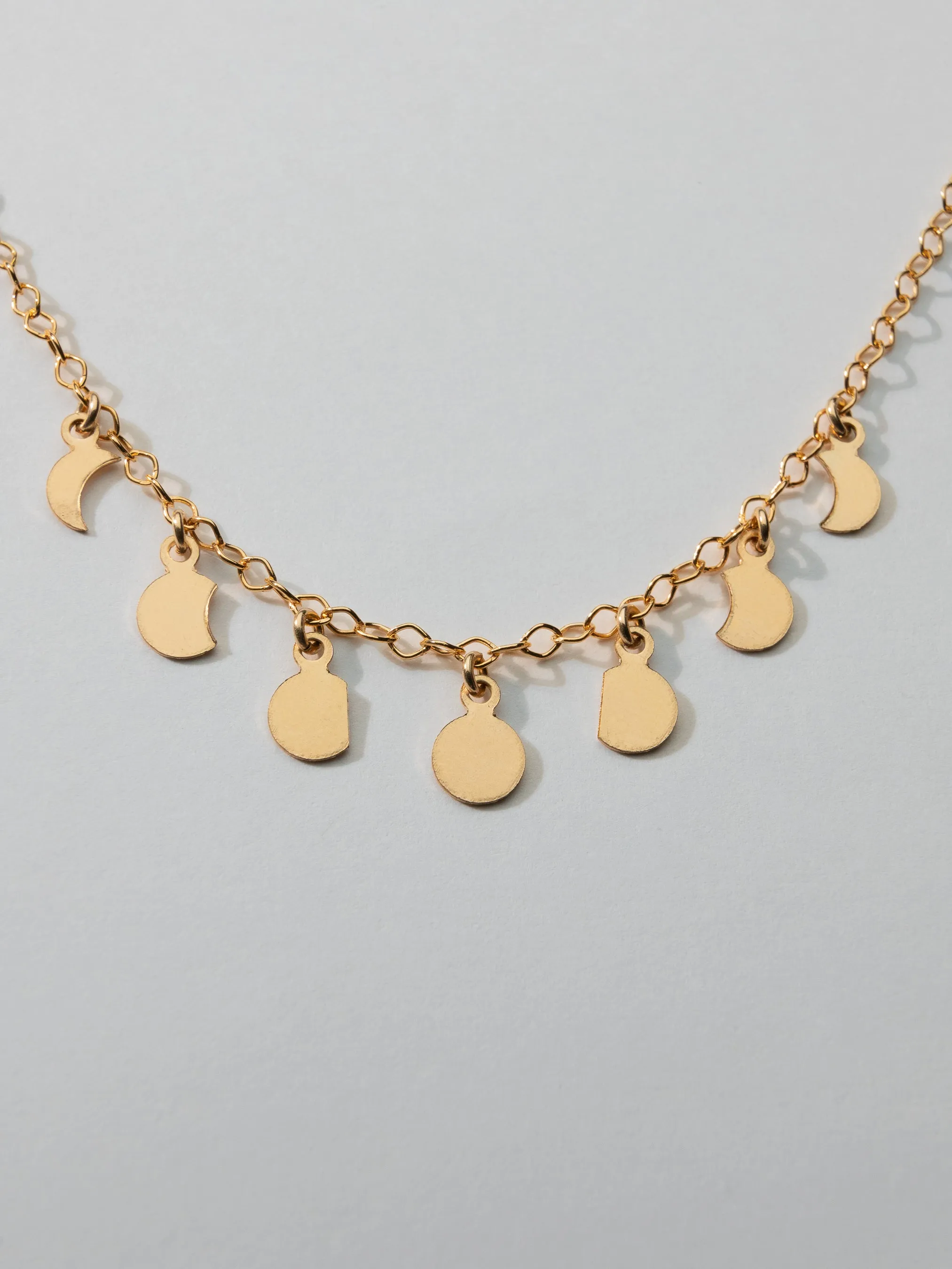 Moon Phase Necklace sold by OXB