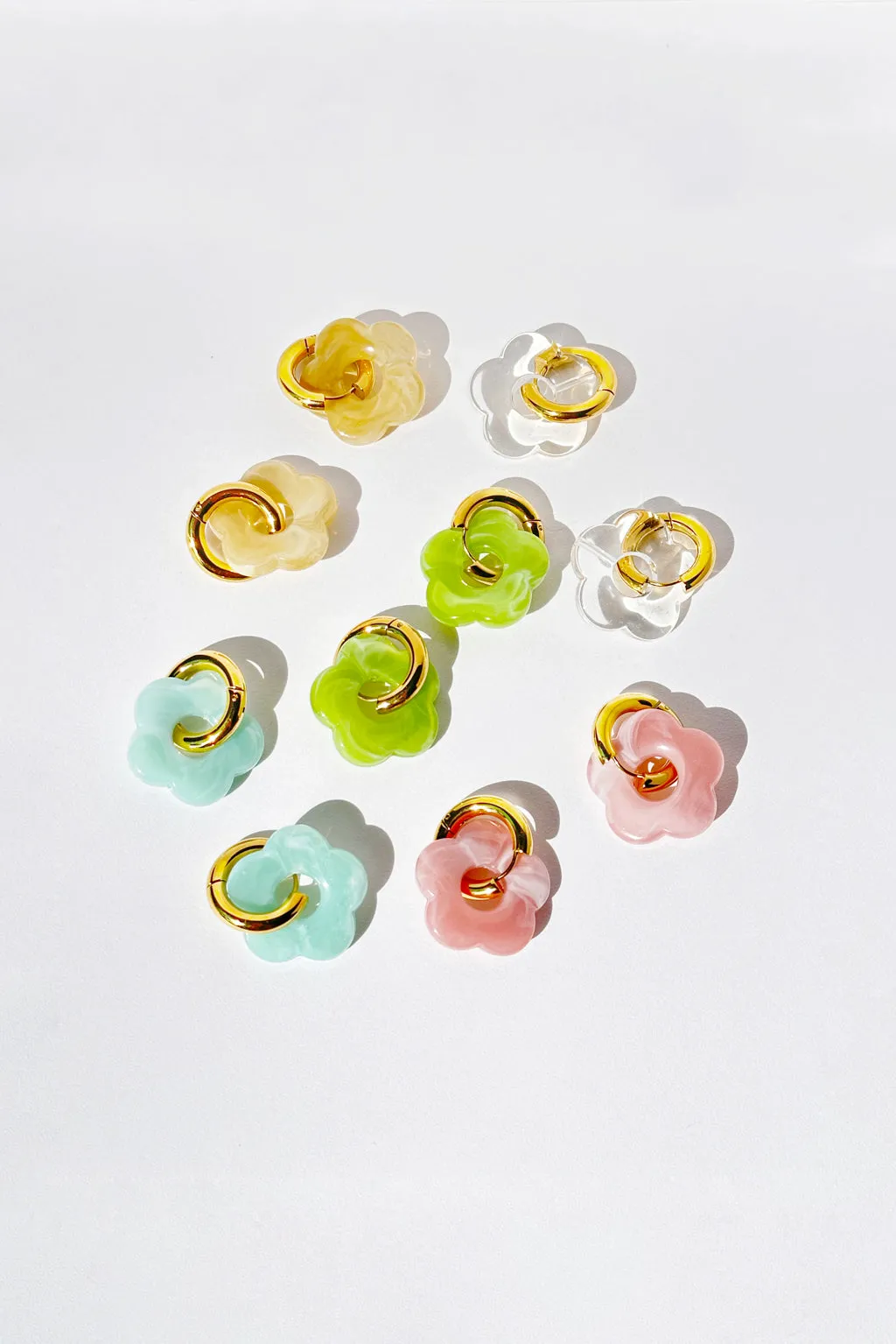 Flower hoop earrings sold by Pheme Paris