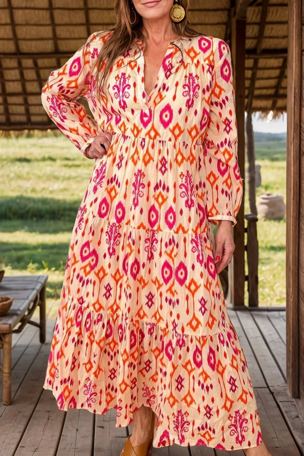 Tiered Printed Notched Long Sleeve Midi Dress sold by Gigi Laurent