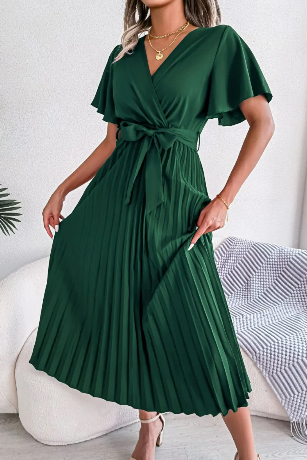 Pleated Flutter Sleeve Belted Dress sold by Gigi Laurent