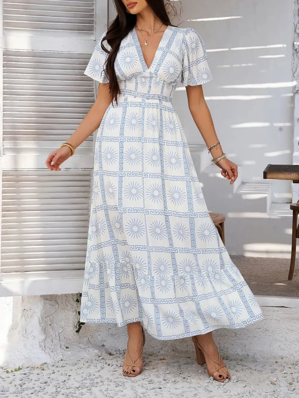 Devine Smocked Printed V-Neck Short Sleeve Maxi Dress sold by Gigi Laurent