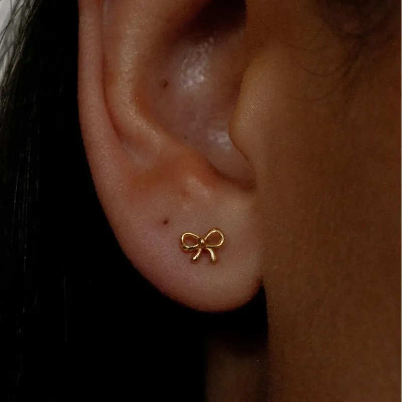 Copper Bow Stud Earrings sold by Gigi Laurent