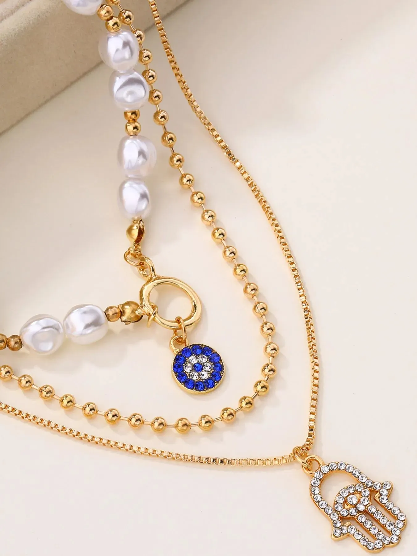 Layered Pearl Chain Evil Eye Hamsa Pendant Necklace sold by Gigi Laurent product image thumbnail 3