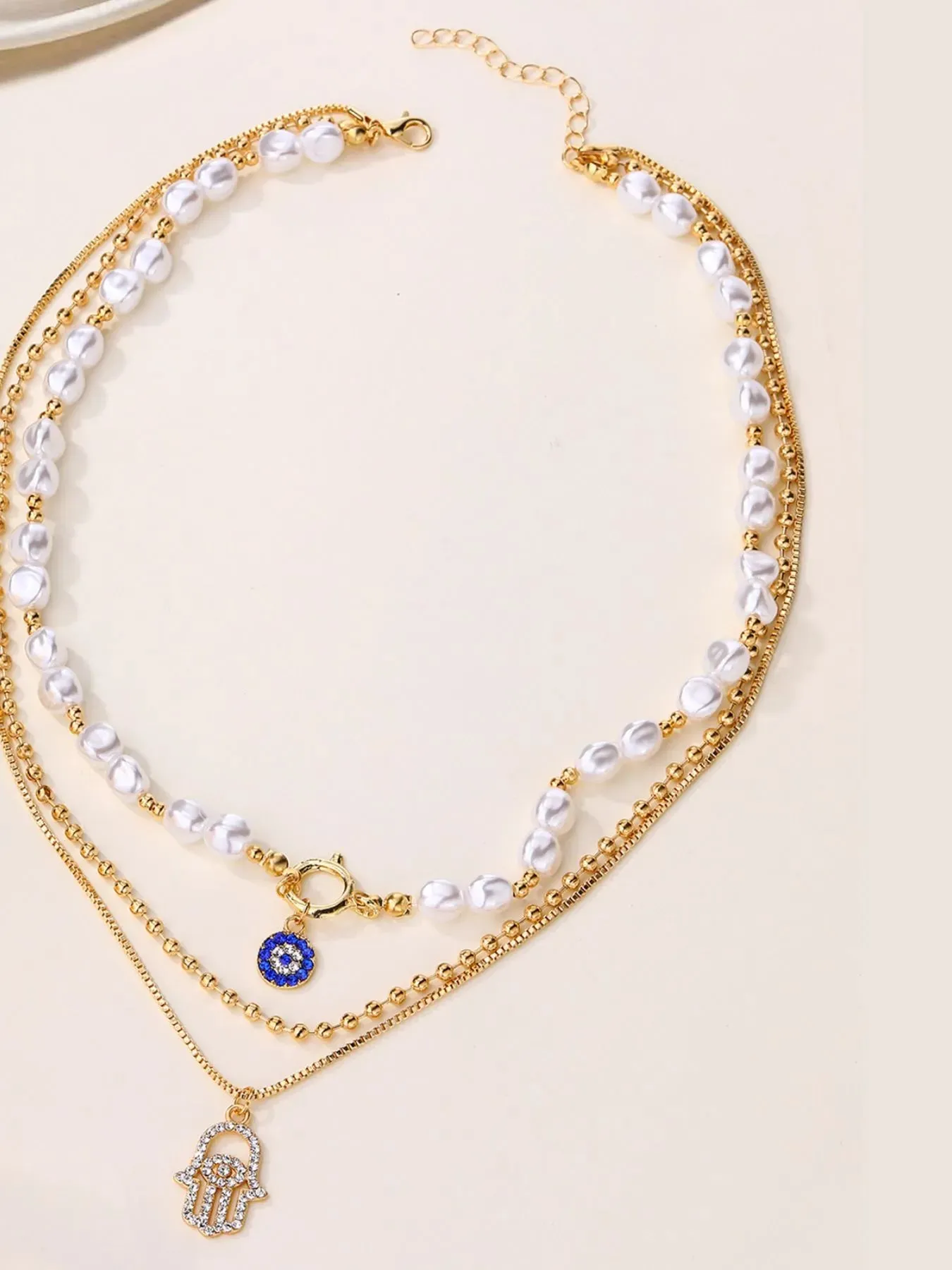 Layered Pearl Chain Evil Eye Hamsa Pendant Necklace sold by Gigi Laurent product image thumbnail 2