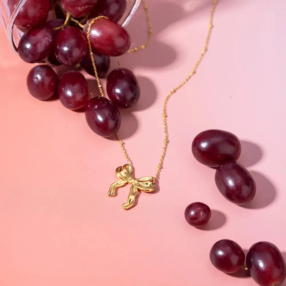 Stainless Steel Bow Pendant Necklace sold by Gigi Laurent product image thumbnail 4