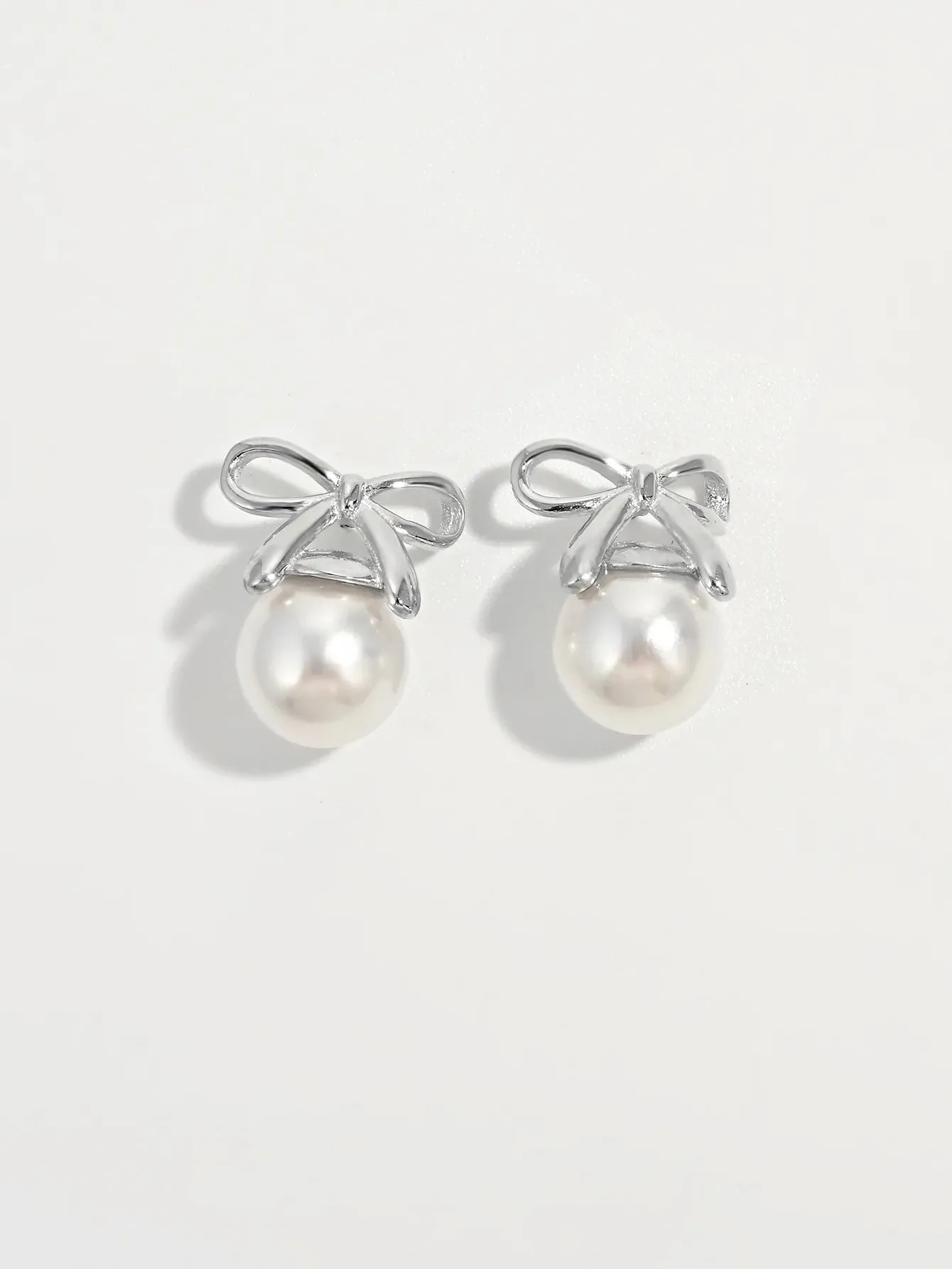 925 Sterling Silver Pearl Bow Earrings sold by Gigi Laurent product image thumbnail 2