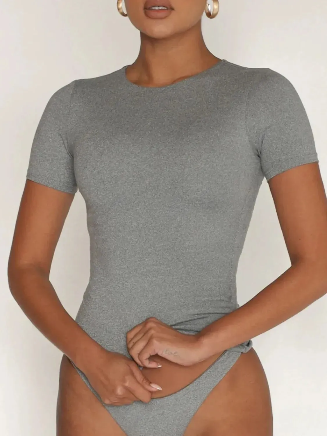 Round Neck Short Sleeve Swim Top sold by Gigi Laurent