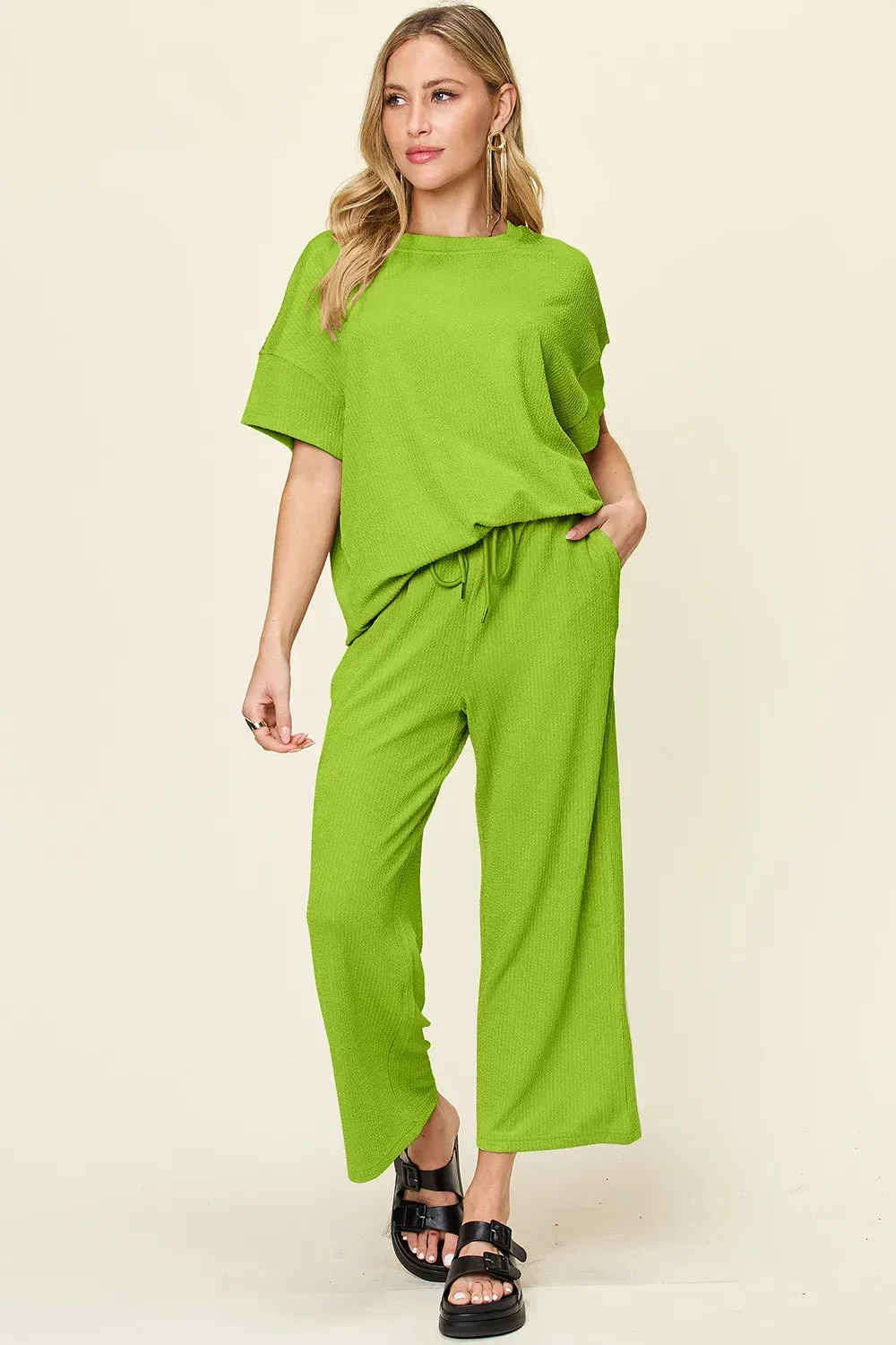 Double Take Full Size Texture Round Neck Short Sleeve T-Shirt and Wide Leg Pants sold by Gigi Laurent