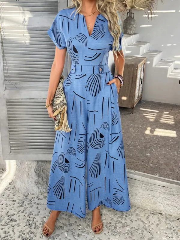 Devine Printed Notched Short Sleeve Wide Leg Jumpsuit sold by Gigi Laurent