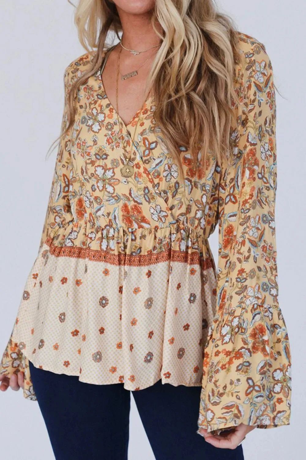 Peplum Printed Surplice Flare Sleeve Blouse sold by Gigi Laurent