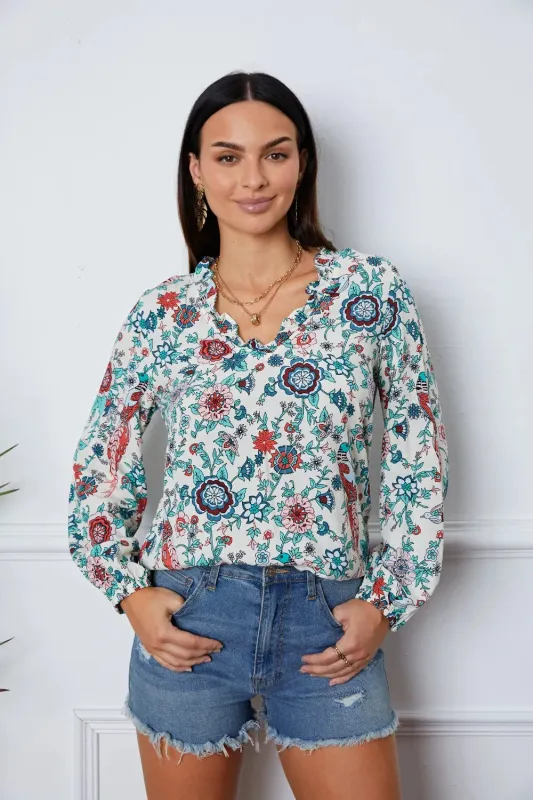 Floral Notched Long Sleeve Blouse sold by Gigi Laurent