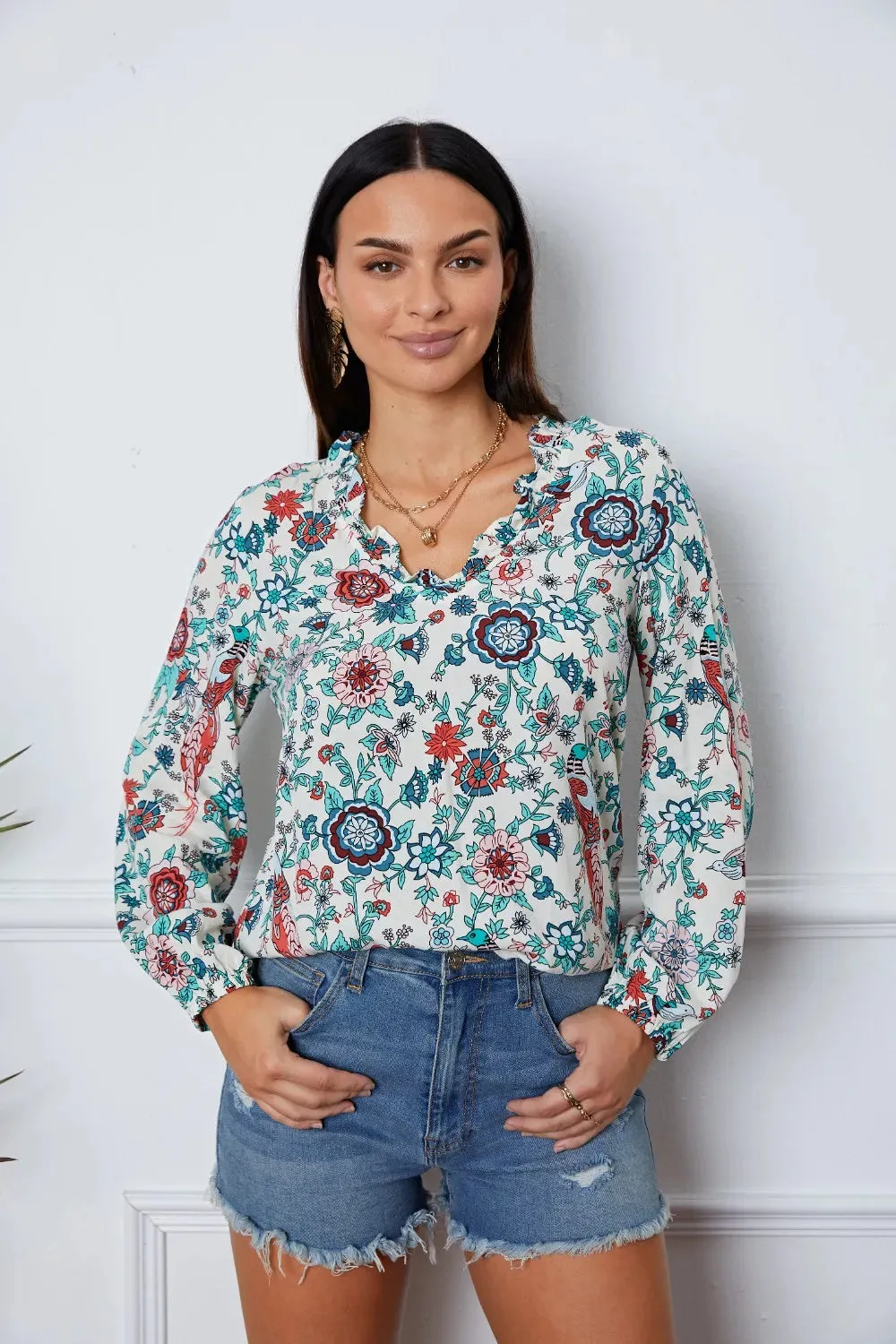 Floral Notched Long Sleeve Blouse sold by Gigi Laurent