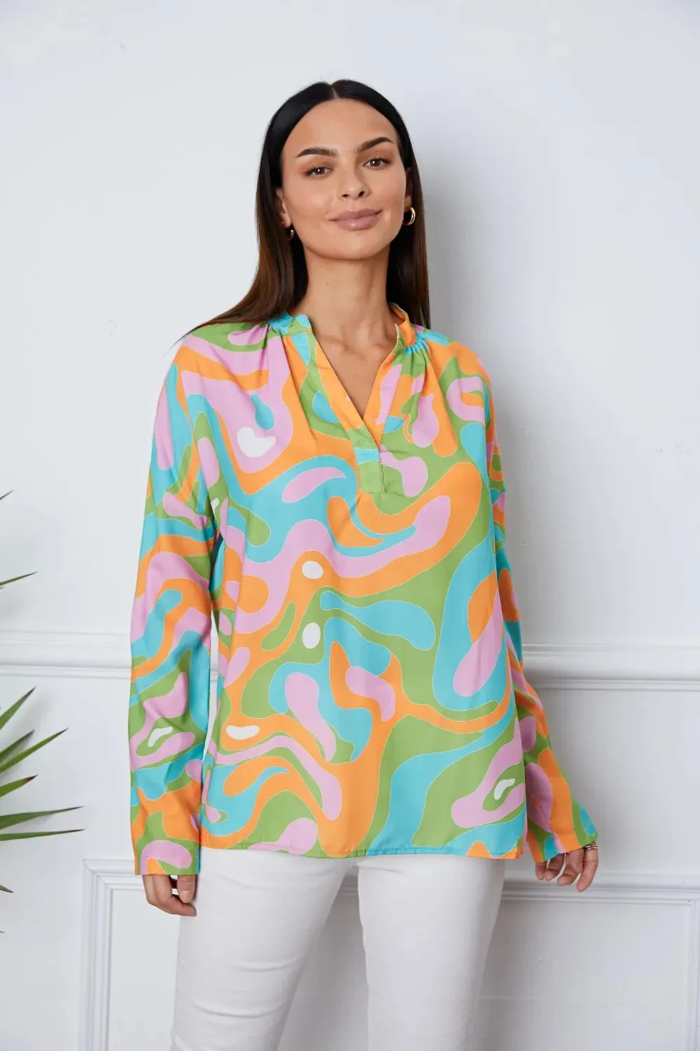 Printed Notched Long Sleeve Blouse sold by Gigi Laurent