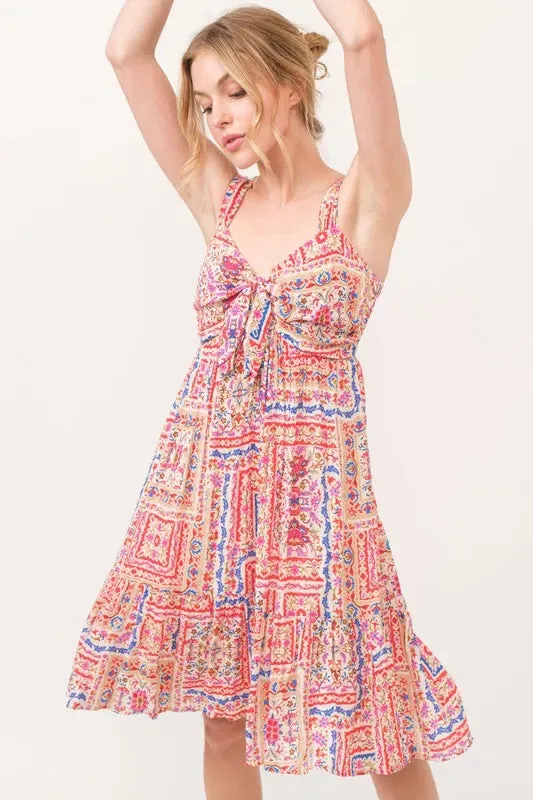 And The Why Tied Front Smocked Back Tiered Boho Printed Dress sold by Gigi Laurent