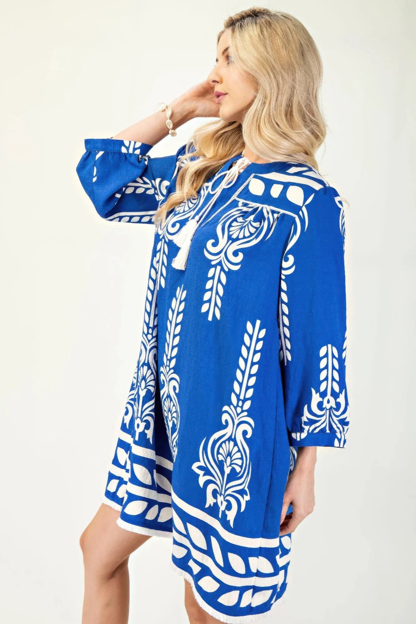 Printed 3/4 Sleeve Dress With Tassel Tie And Fringe Detail On Hem sold by Gigi Laurent product image thumbnail 3