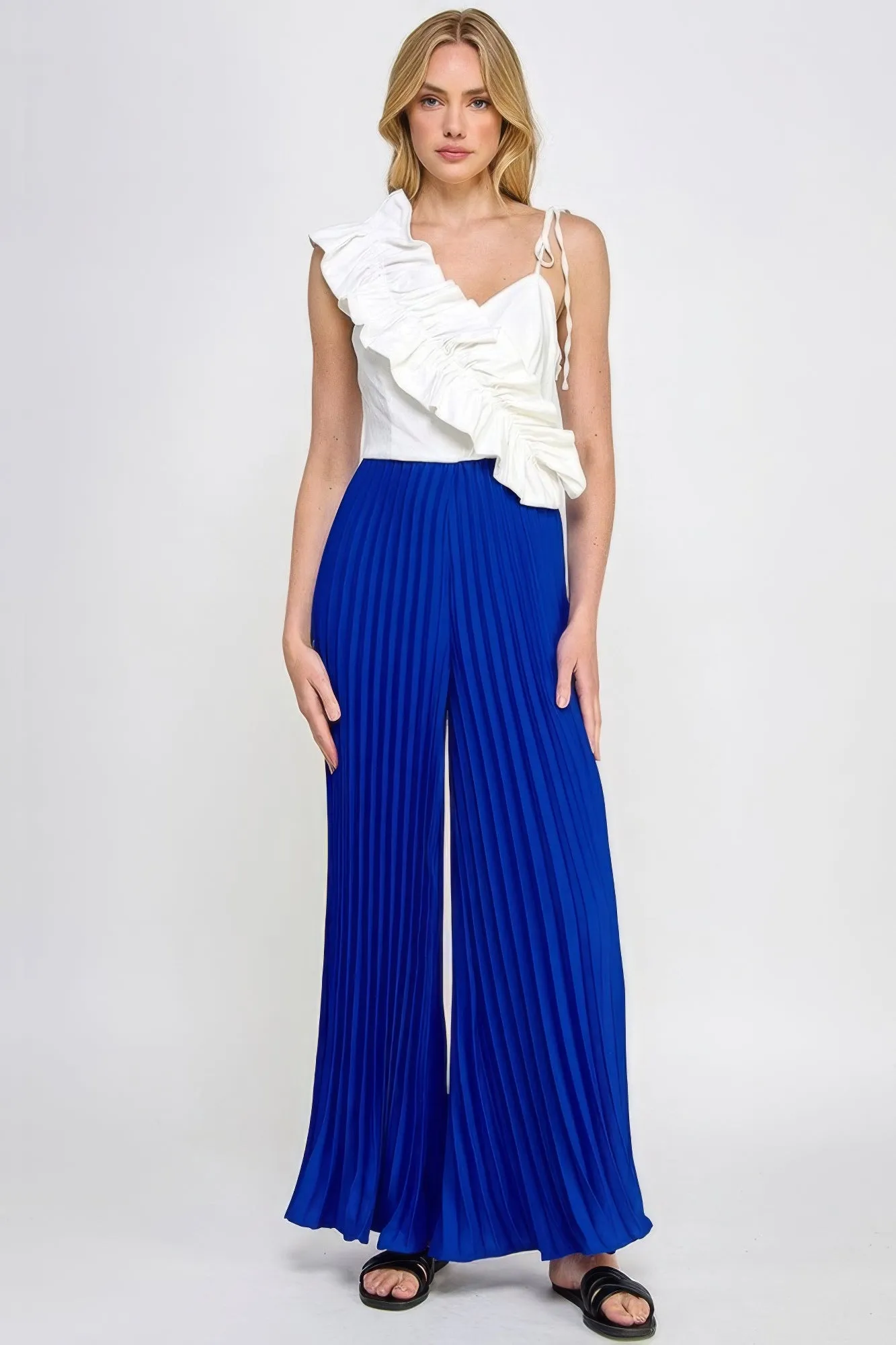 Cami Asymmetrical Ruffle Detail Pleated Bottom Jumpsuit sold by Gigi Laurent