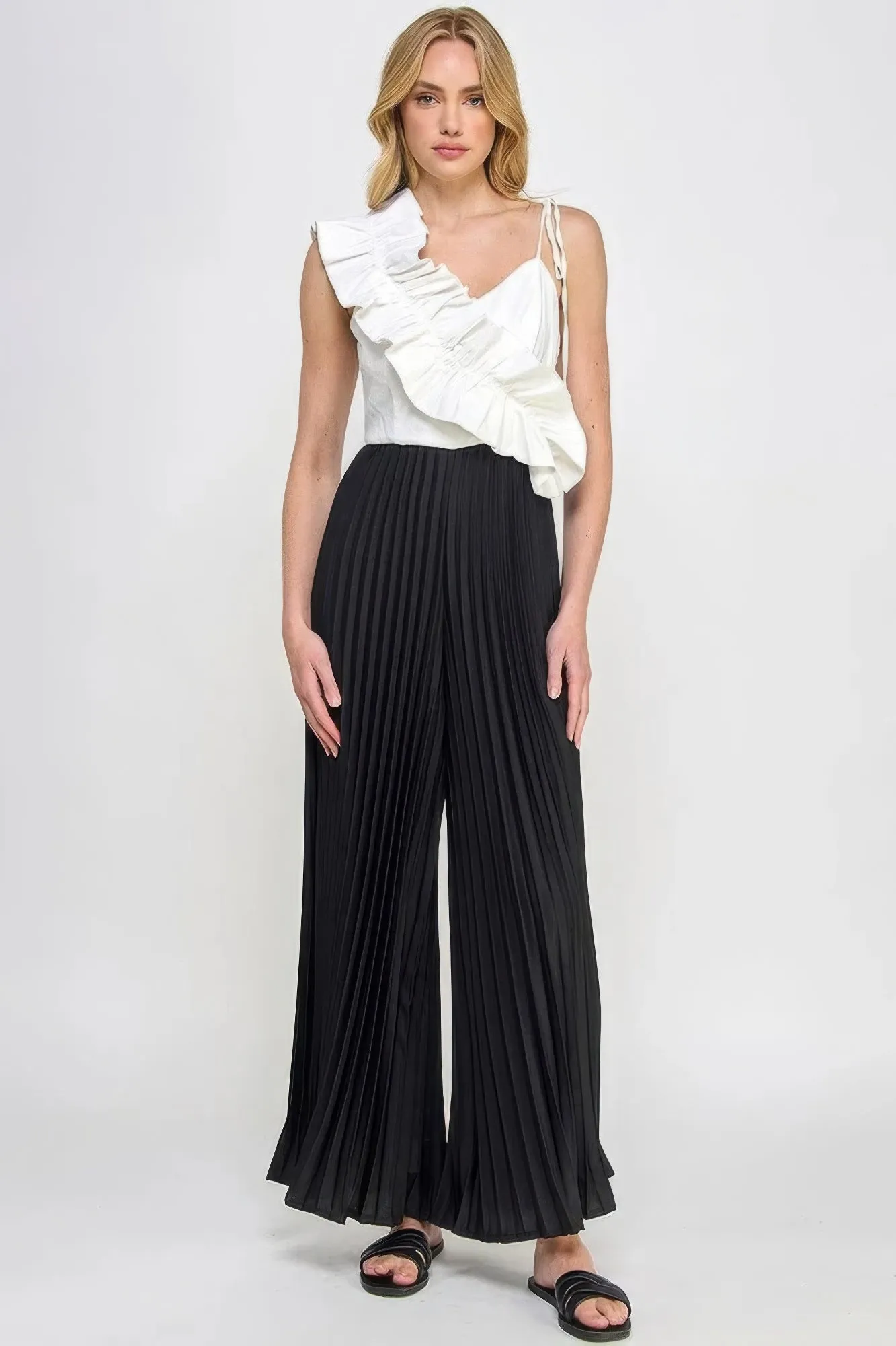 Cami Asymmetrical Ruffle Detail Pleated Bottom Jumpsuit sold by Gigi Laurent