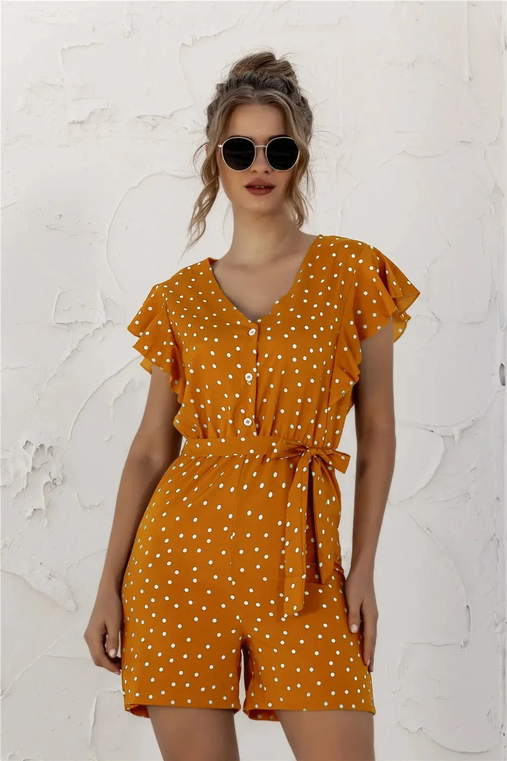 Ruffled Polka Dot Half Button Romper sold by Gigi Laurent