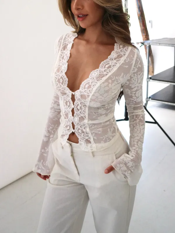 Pretty cream rose top - cream sold by Venderbys