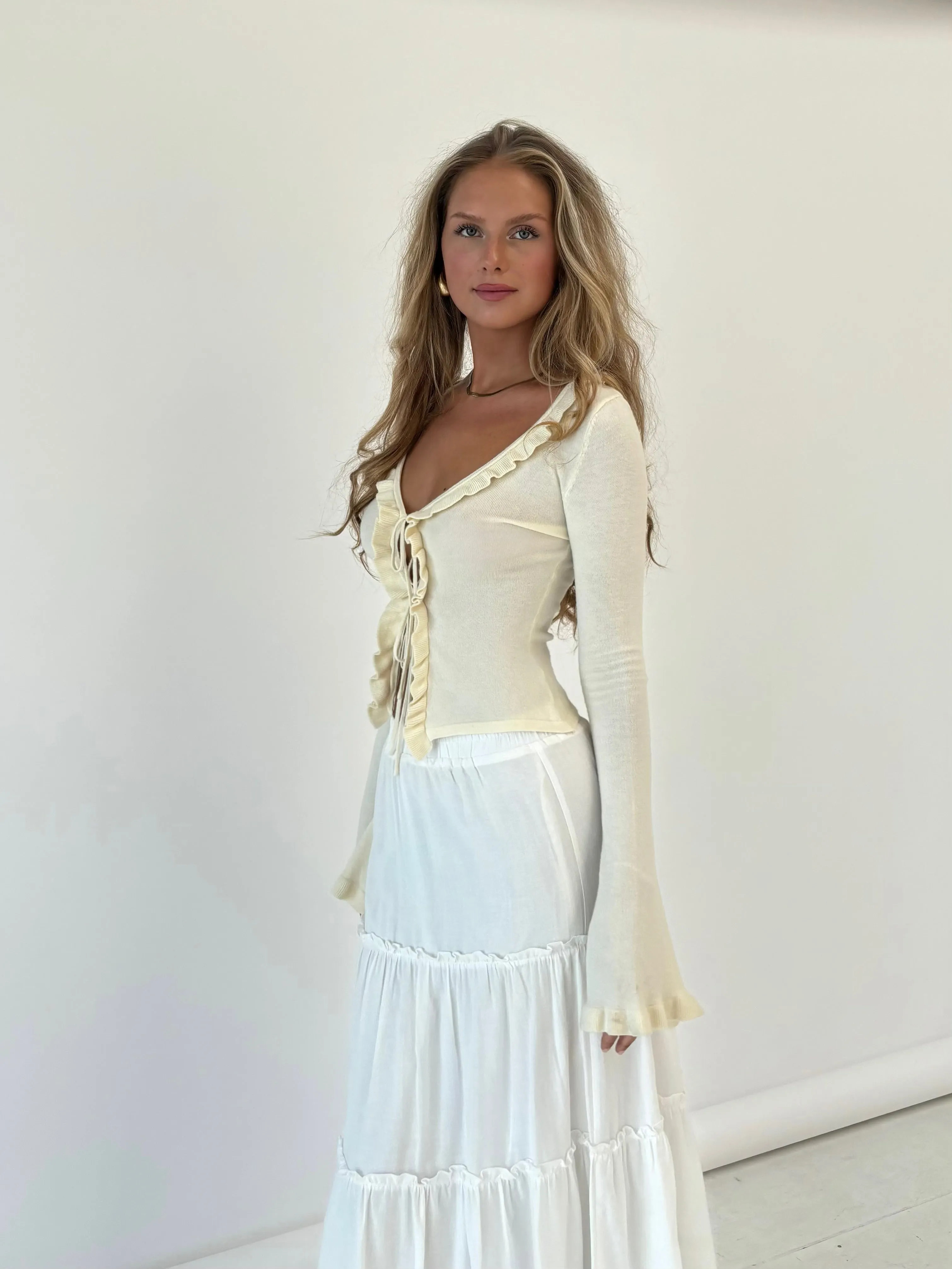 Ruffle knit top - cream sold by Venderbys