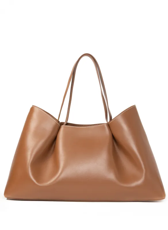 Dimple Tote Leather Cognac/White Stitches sold by Elleme