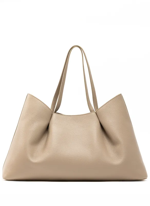 Dimple Tote Pebbled Leather Taupe sold by Elleme