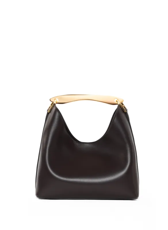 Small Boomerang Leather Tabacco sold by Elleme