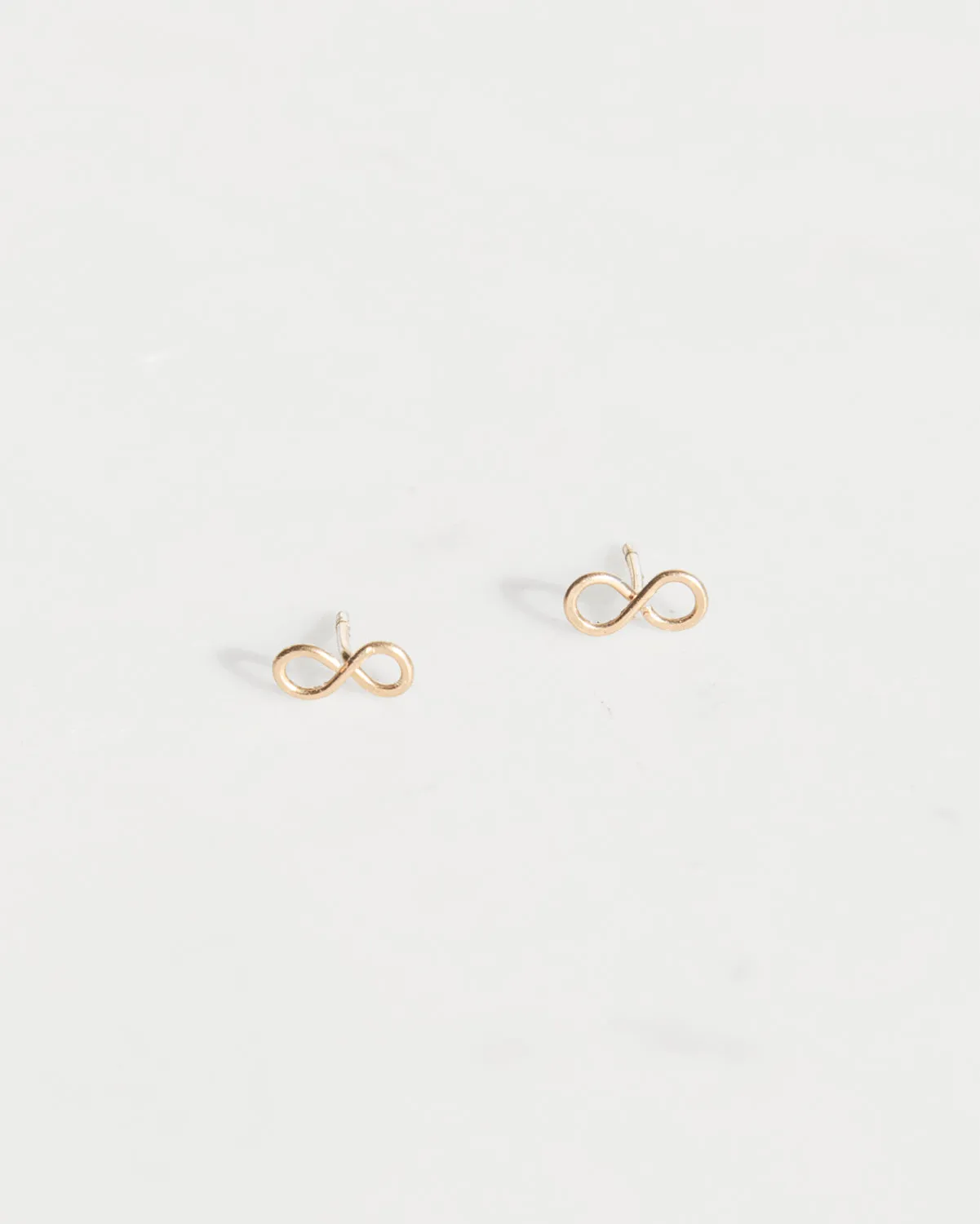 14K Infinity Studs sold by Mary MacGill