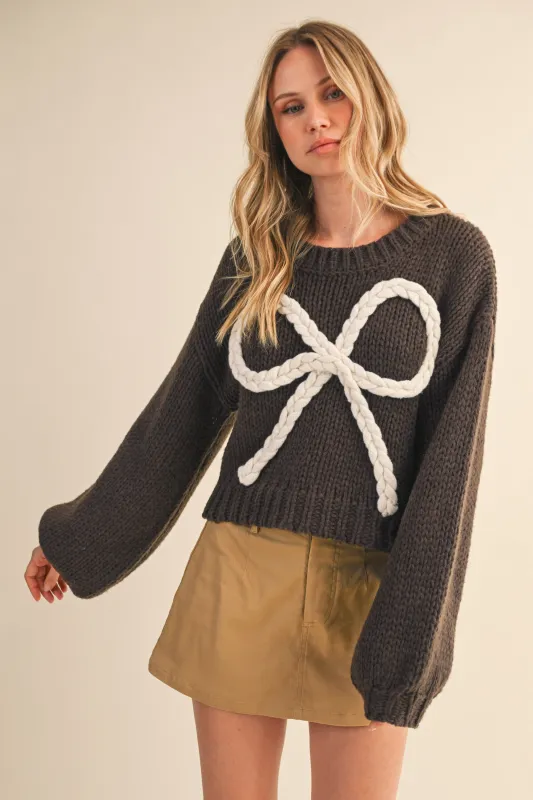 The Coquette Sweater sold by Brightside Boutique