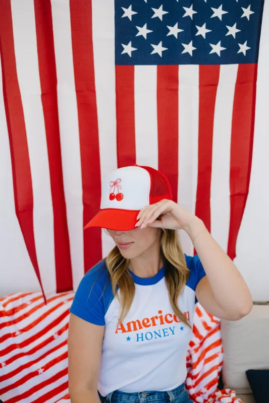 Cherry Bow Trucker Hat sold by Brightside Boutique