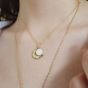 Dreamchaser Gold Spinning Necklace sold by Wanderlust and Co