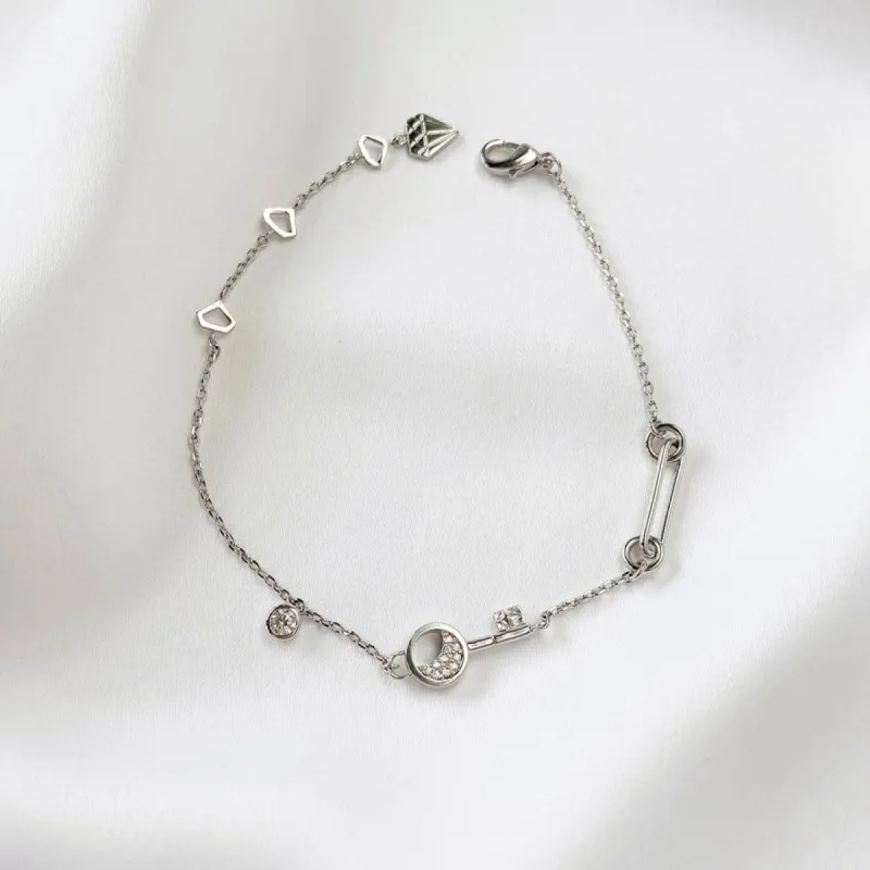 Crescent Key Silver Bracelet sold by Wanderlust and Co