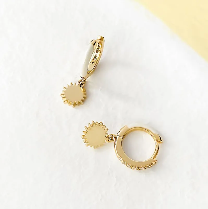 Sun Ivory & Gold Huggie Earrings sold by Wanderlust and Co