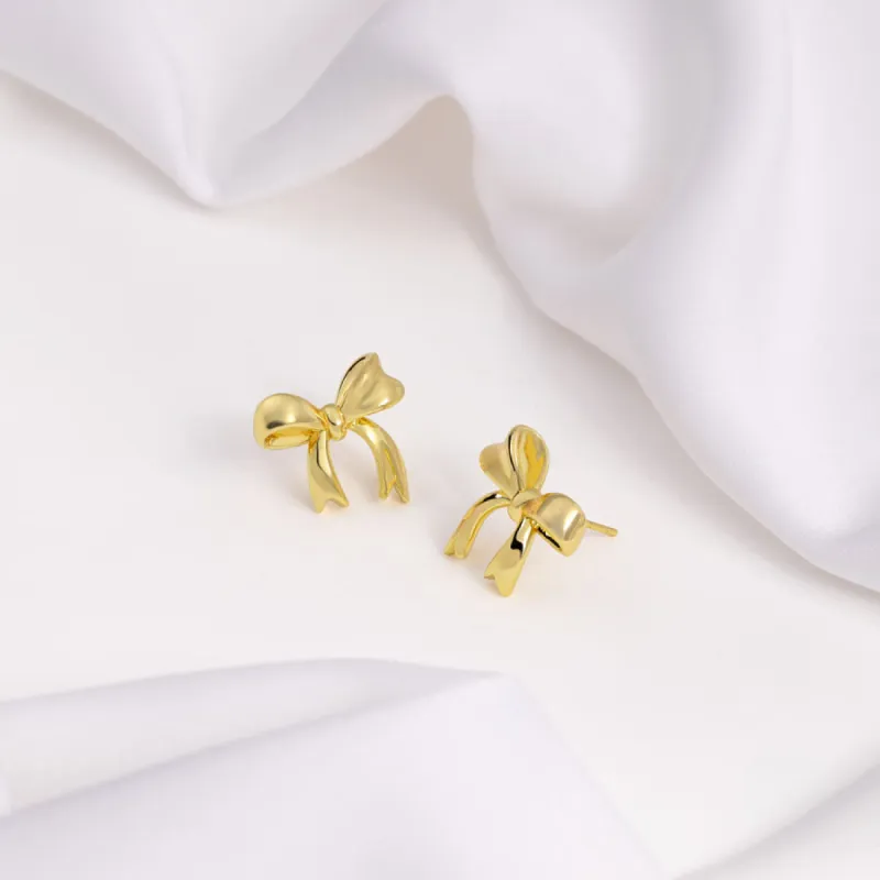 Bow Gold Stud Earrings sold by Wanderlust and Co