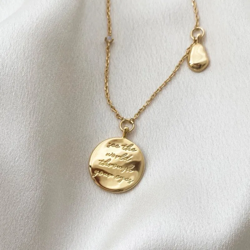 See the World Gold Necklace sold by Wanderlust and Co