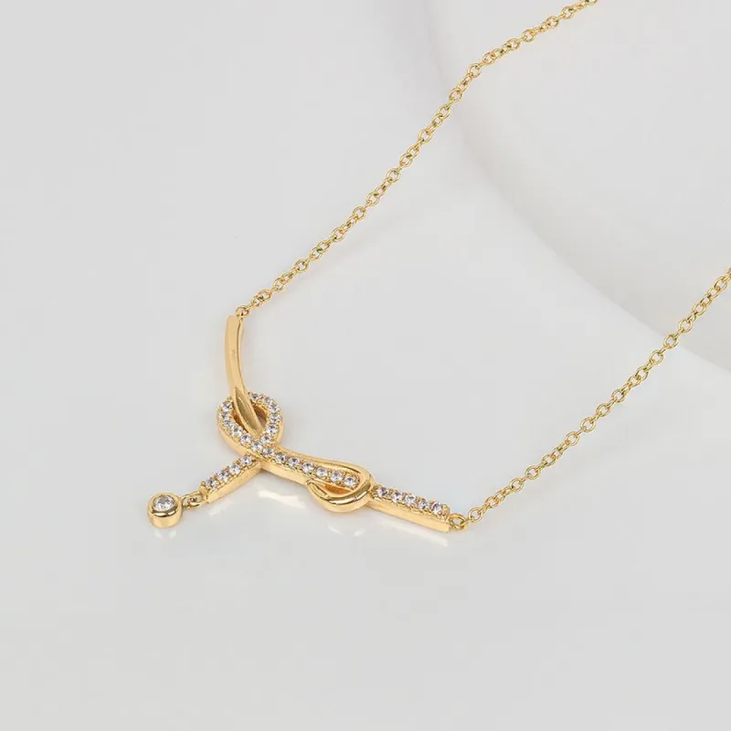 Knot Pave Gold Drop Necklace sold by Wanderlust and Co