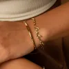 Wanderlust Gold Bangle sold by Wanderlust and Co