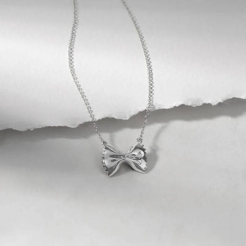 Bow Tie Pasta Silver Necklace sold by Wanderlust and Co