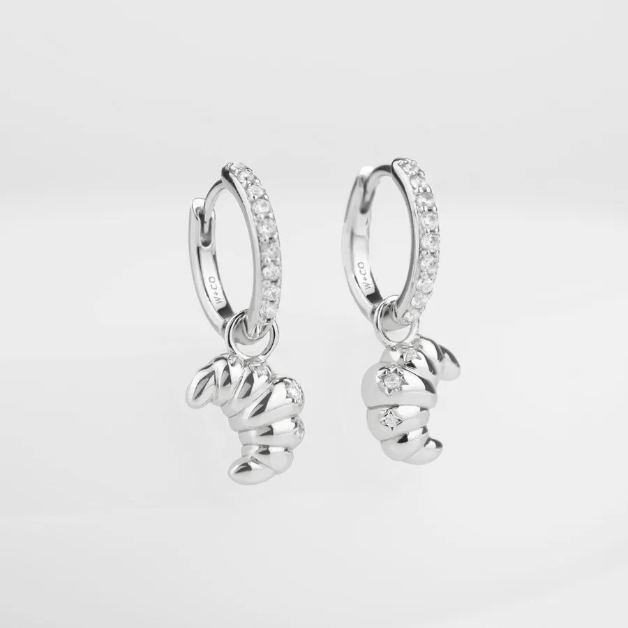 Croissant Charm Silver Huggie Earrings sold by Wanderlust and Co
